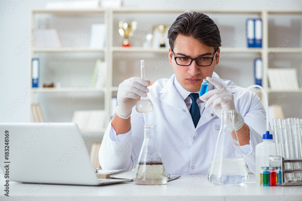 Young researcher scientist doing a water test contamination expe Young researcher scientist doing a water test contamination expe