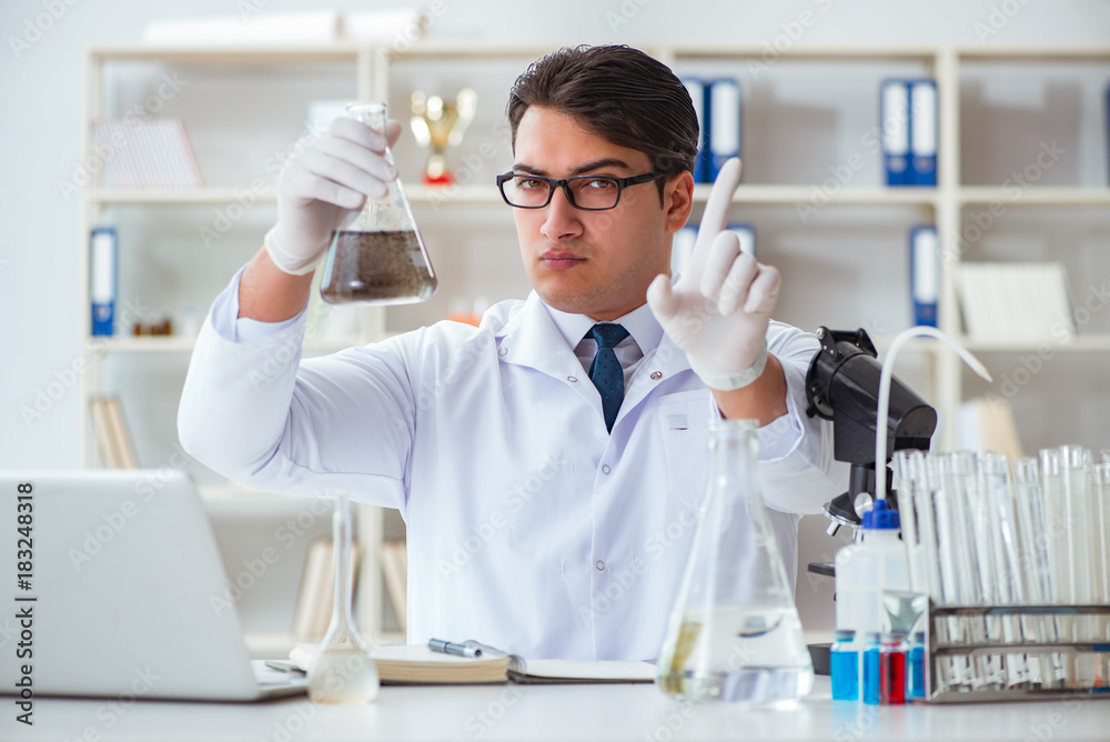 Young researcher scientist doing a water test contamination expe Young researcher scientist doing a water test contamination expe