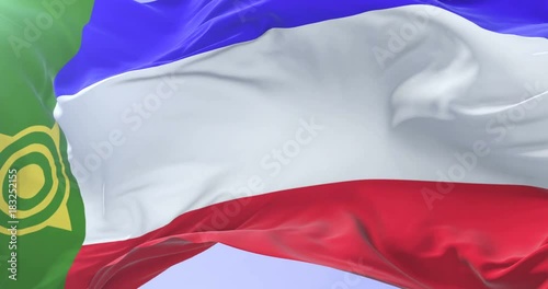 Khakassia flag waving at wind with blue sky in slow, loop photo