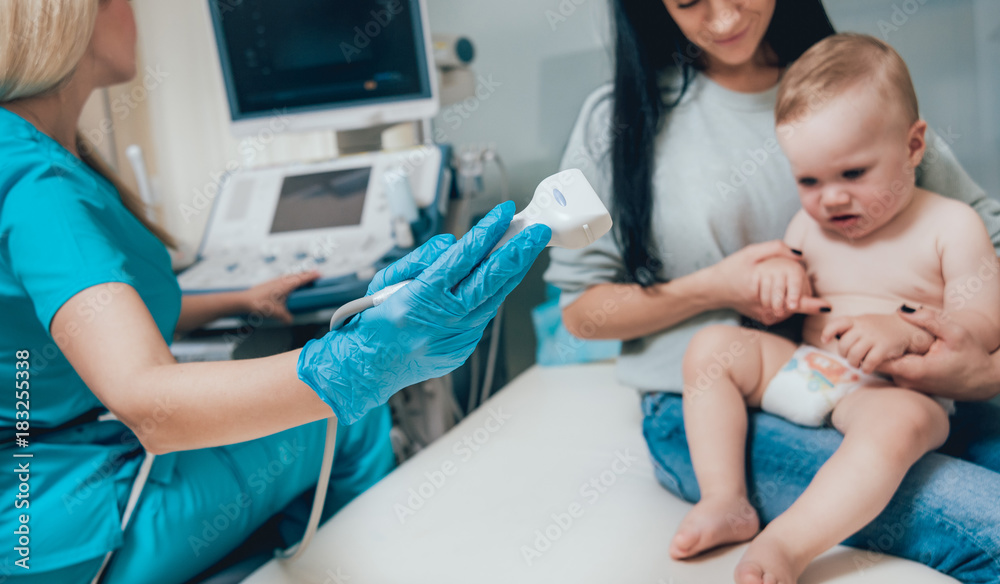Doctor and little boy patient. Ultrasound equipment. Diagnostics. Sonography. Doctor and little boy patient. Ultrasound equipment. Diagnostics. Sonography.