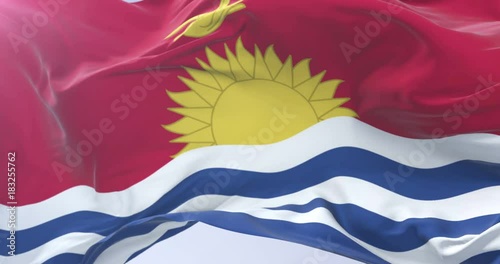 Kiribati flag waving at wind in slow in blue sky, loop photo