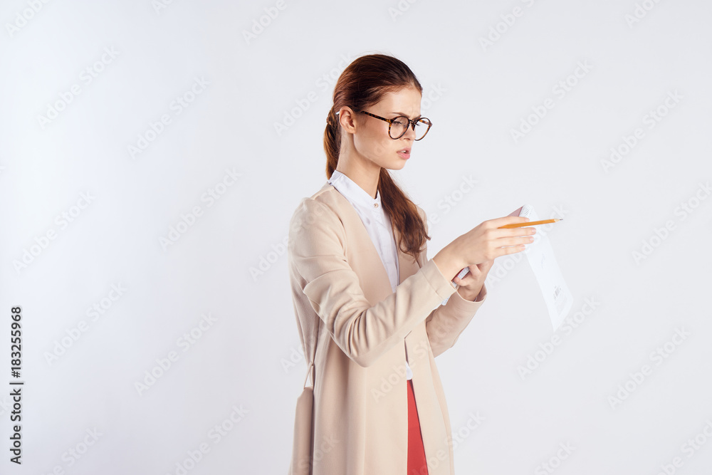 business woman looking at a note in a notebook business woman looking at a note in a notebook