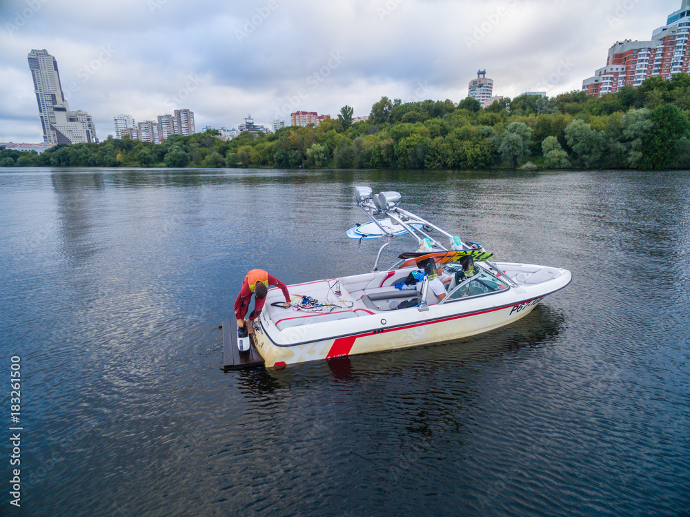 Fototapeta premium Waterskiing boat on river