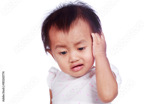 sad baby in depression tearing hair on head isolated on white background