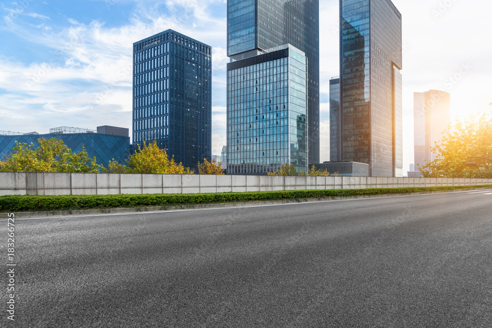 Empty urban road and modern skyline in the city Empty urban road and modern skyline in the city
