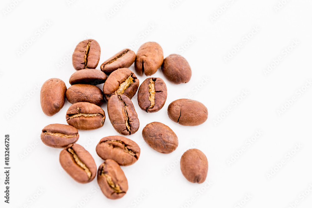 Roasted coffee beans on wood texture background. Roasted coffee beans on wood texture background.