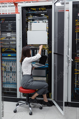 Portrait of a female executive in server room