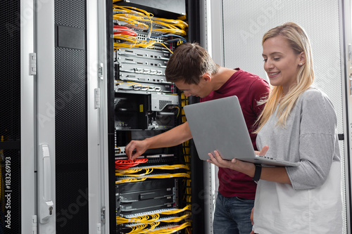 team of busienss people working in server room photo