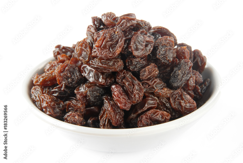 Black raisins on a white background         