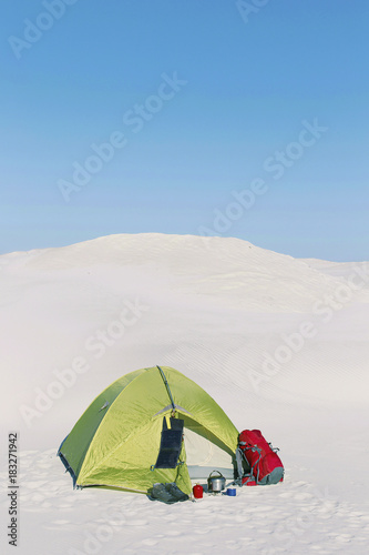 Winter trip. The tent is on top of a hill.