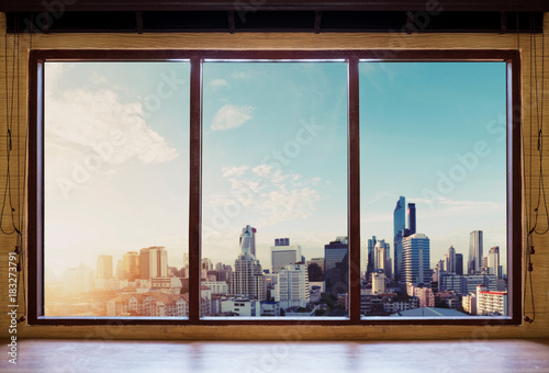 Papier peint Looking through window in the morning, Bangkok city view in sunrise
