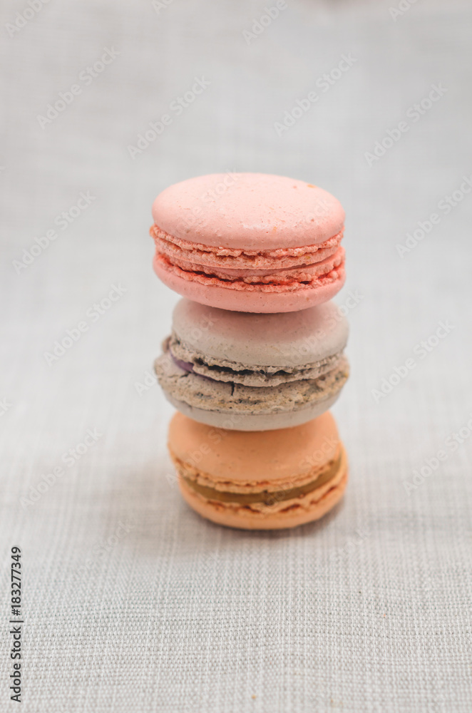 Delicious cake macaroons on light background, close up Delicious cake macaroons on light background, close up