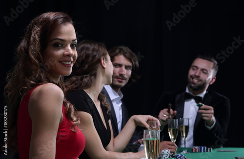 adult group celebrating friend winning blackjack