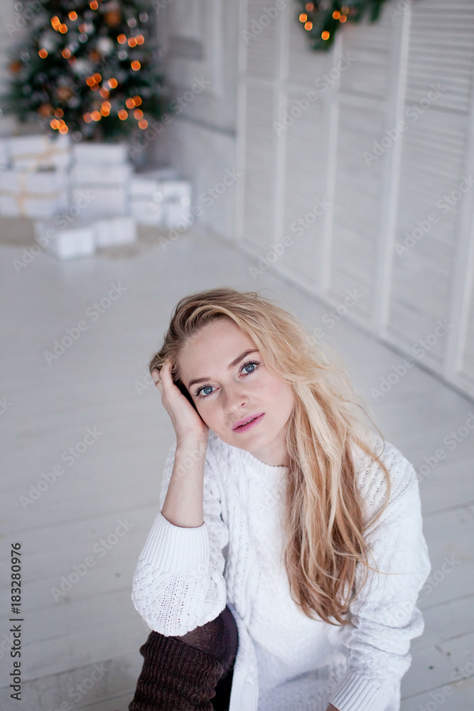Beautiful girl on the background of a Christmas tree Beautiful girl on the background of a Christmas tree