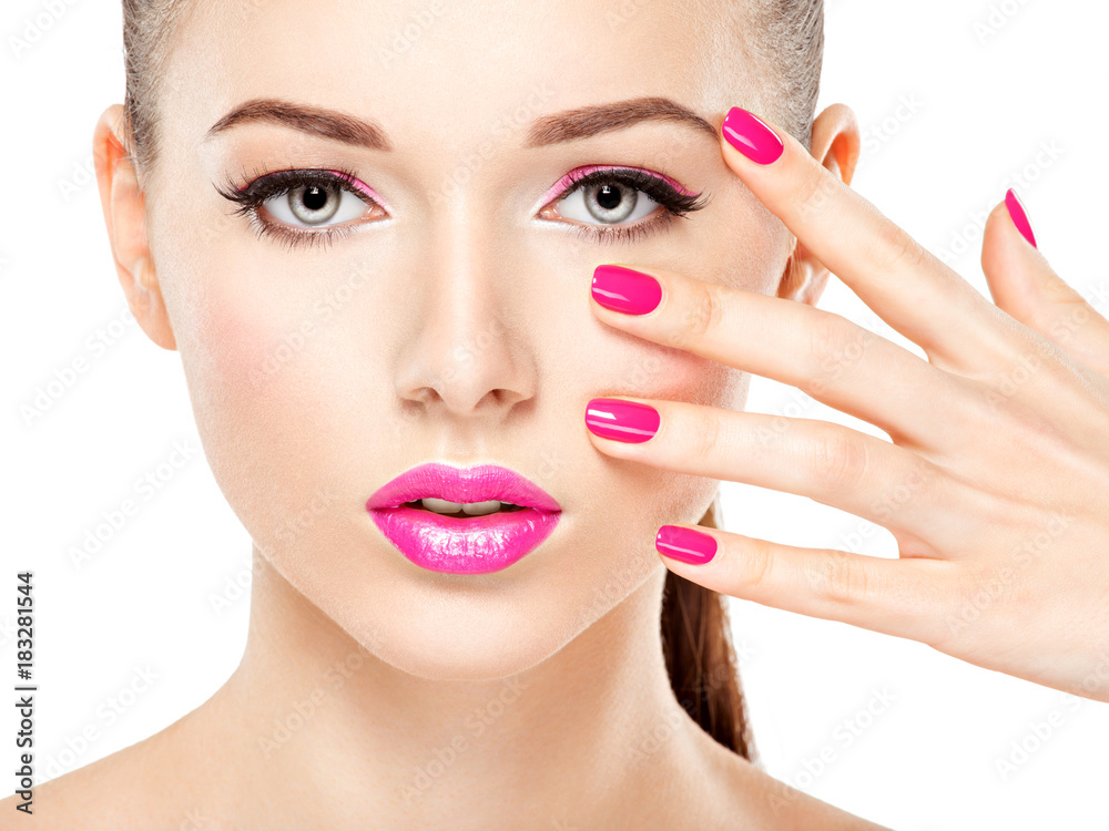 eautiful woman face with pink makeup of eyes and nails. eautiful woman face with pink makeup of eyes and nails.