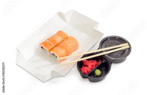 Sushi with salmon in box for take-out food, condiments