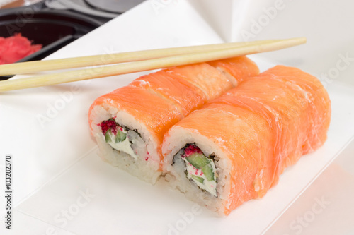 Sushi with salmon in box for take-out food closeup