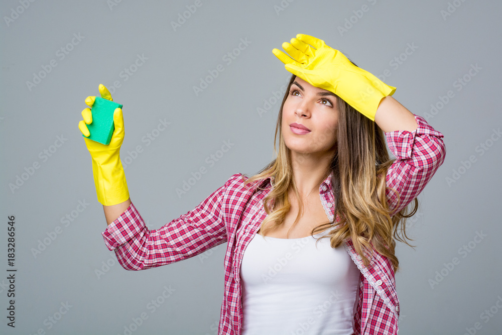 Young woman doing house cleaning. Young woman doing house cleaning.