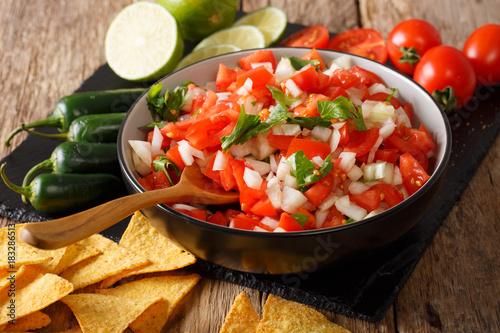 Canvas-taulu Mexican pico de gallo from tomatoes, onions, cilantro and jalapeno pepper close-up