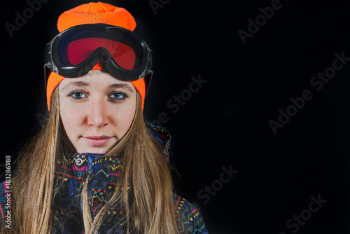 Portrait of girl with ski mask and snowboard © michelangeloop