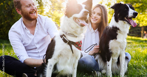 Photography Couple playing with dogs