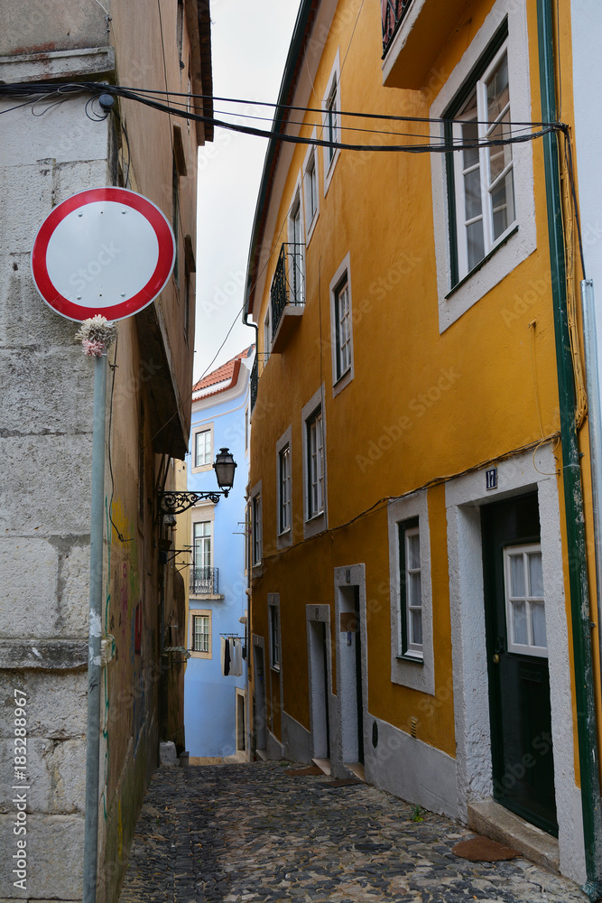 Fototapeta premium Colorful street in Alfama quarter, old picturesque part of Lisbon, Capital of Portugal