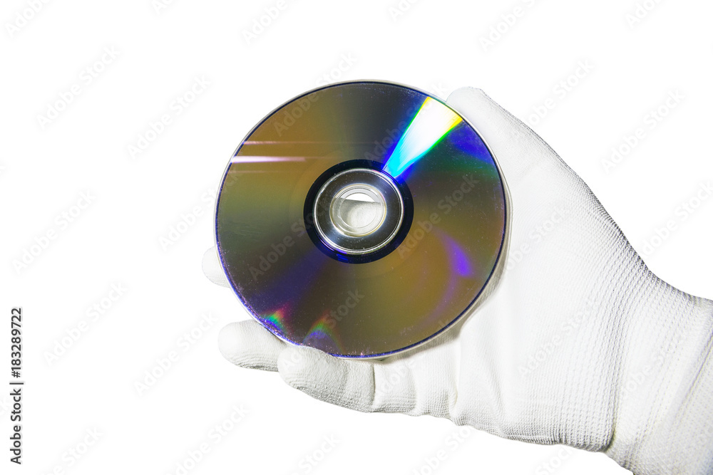 Hand in a white glove holding the compact disc CD. Isolated on white background Hand in a white glove holding the compact disc CD. Isolated on white background