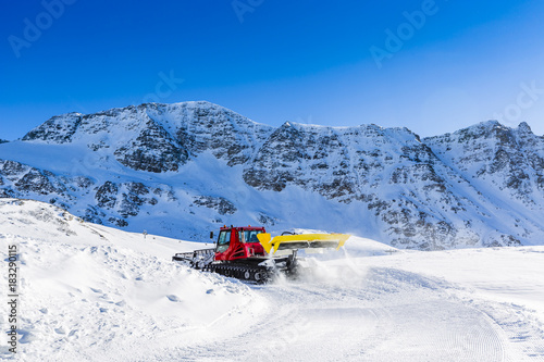 Snow removal ski slopes and trails in the Italian Alps. 