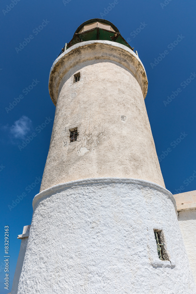 A white lighthouse  in The Prasonisi National Park on the  southern end of Rhodes in Greece 
