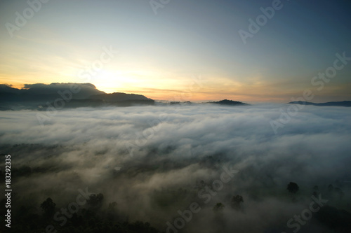 sunrise over the hills with sea fog