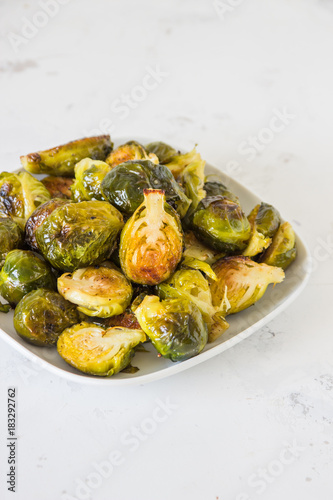 Cooked Brussels sprouts in a white plate