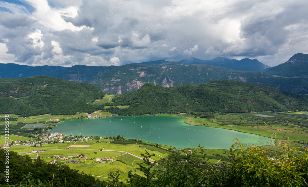 Fototapeta premium Lake Caldaro along the South Tyrolean Wine Route is the warmest bathing lake in the Alps. Trentino Alto Adige, Italy
