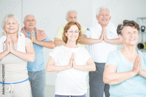 Group of senior people meditating
