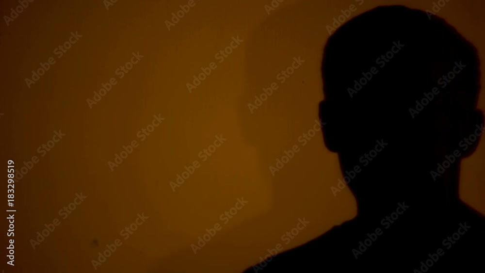 Shadow of man counting on fingers time before important moment, silhouette