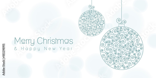 Merry Christmas and Happy New Year greeting card with a Christmas swirl ball on a light blurry background
