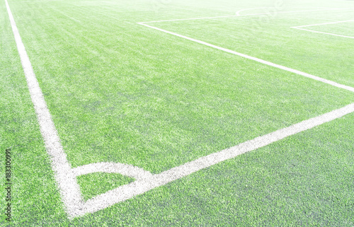 surface of Artificial turf with White corner line on the green football/soccer field from top view for background