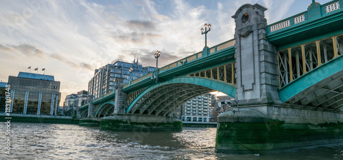 London Southwark bridge in Thames river UK. photo