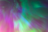 Polar lights Aurora Borealis in the night starry sky, texture and multi-colored natural phenomena.