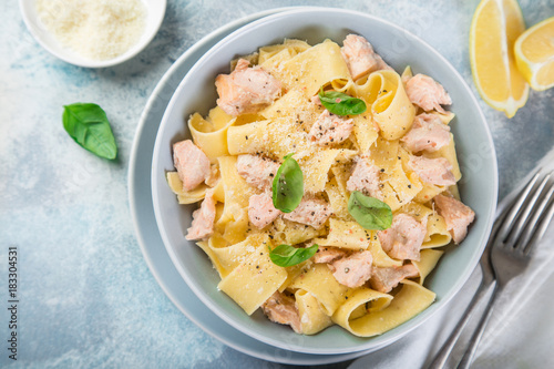 pappardelle pasta with salmon in creamy sauce photo