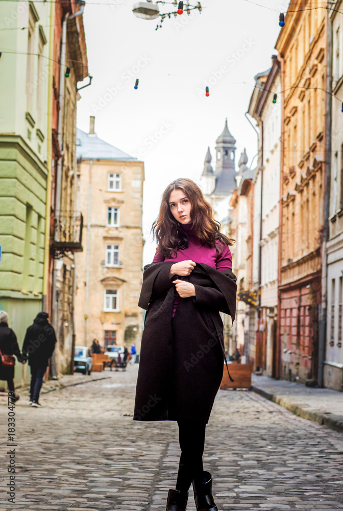 Brunette girl walking on the street