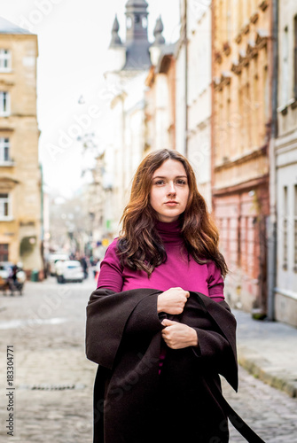 Brunette girl walking on the street © Yuliia