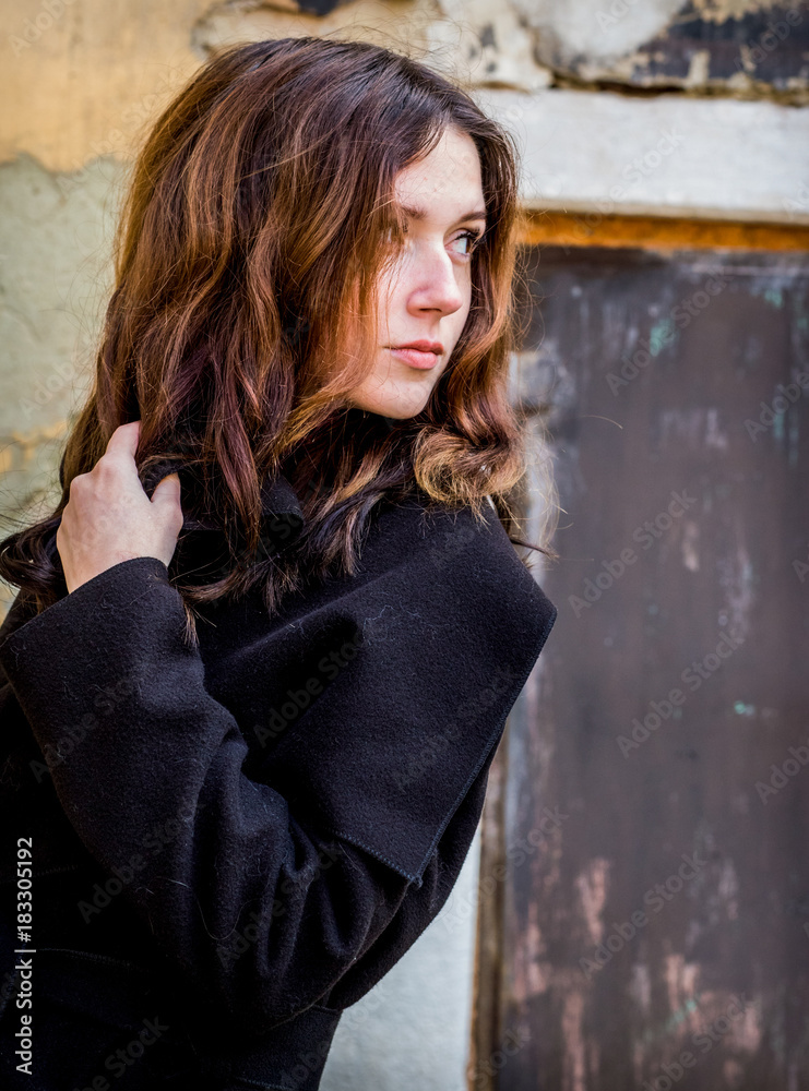 A mysterious girl in a black coat A mysterious girl in a black coat