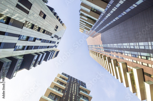 Office buildings stretch up to the sky in Milan Italy, Low angle view of business buildings up to sky.