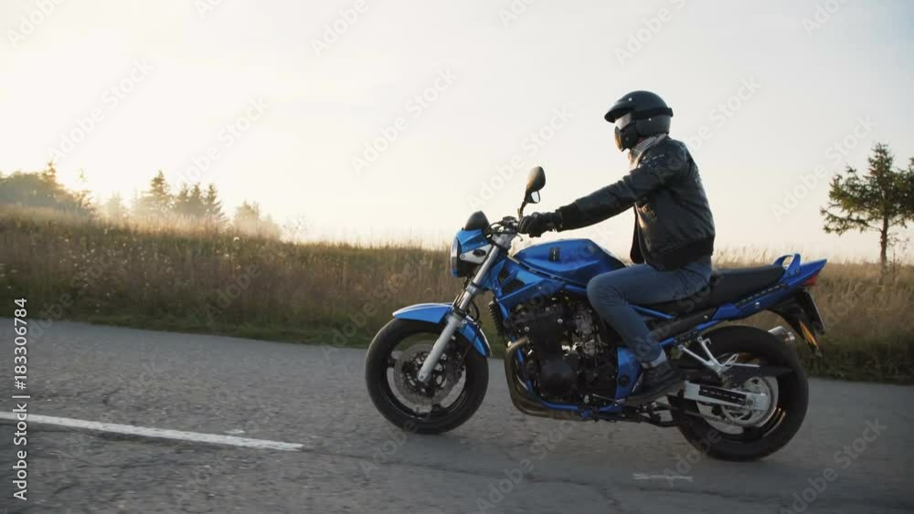The biker riding on the modern motocycle on the road. 4K The biker riding on the modern motocycle on the road. 4K