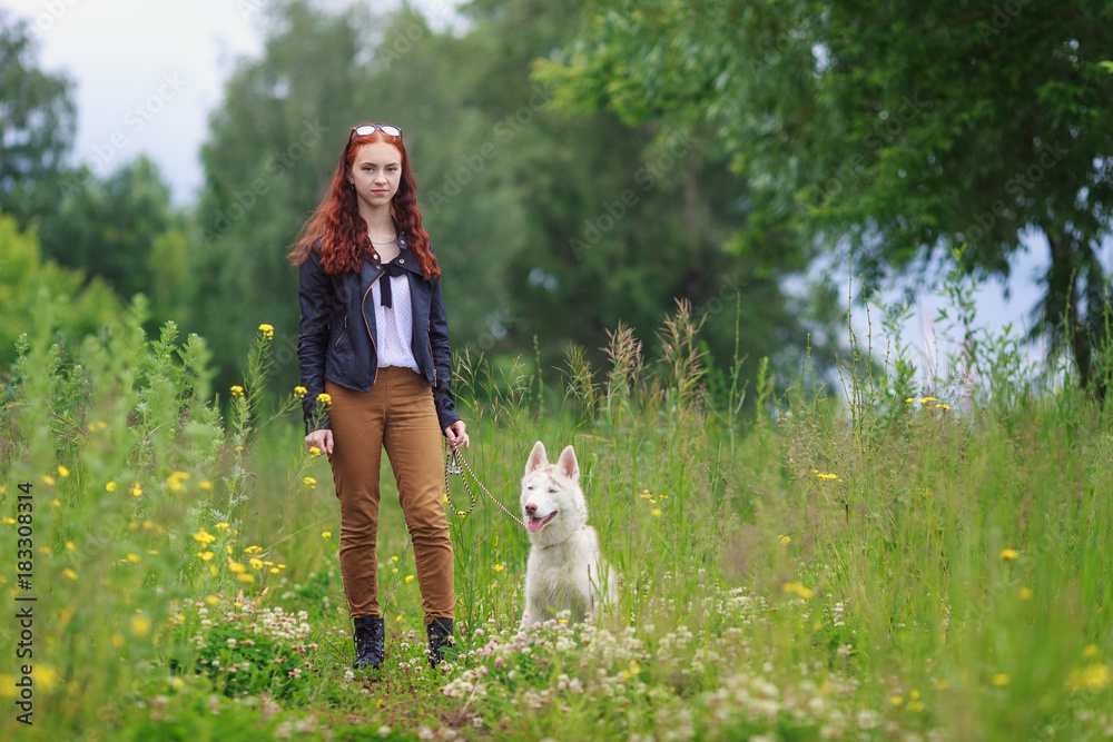 Young woman with a dog for a walk in the park Young woman with a dog for a walk in the park