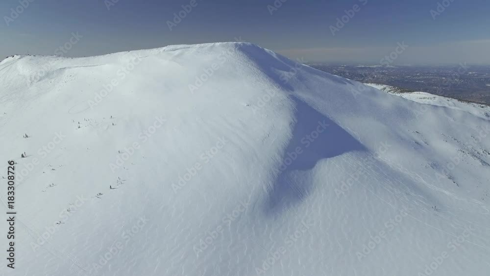 drone shot snow mountain with traces of descents 4K drone shot snow mountain with traces of descents 4K