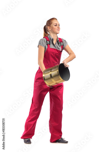 Young woman in a red jumpsuit with bucket .