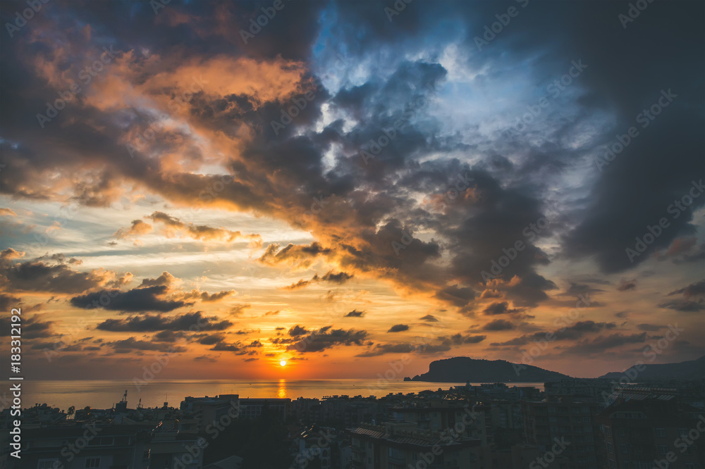 View from balcony of sunset over sea and evening dramatic sky, Alanya, Mediterranean Turkey coast