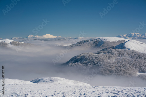 Wallpaper Mural view of the mountain peaks above the clouds Torontodigital.ca
