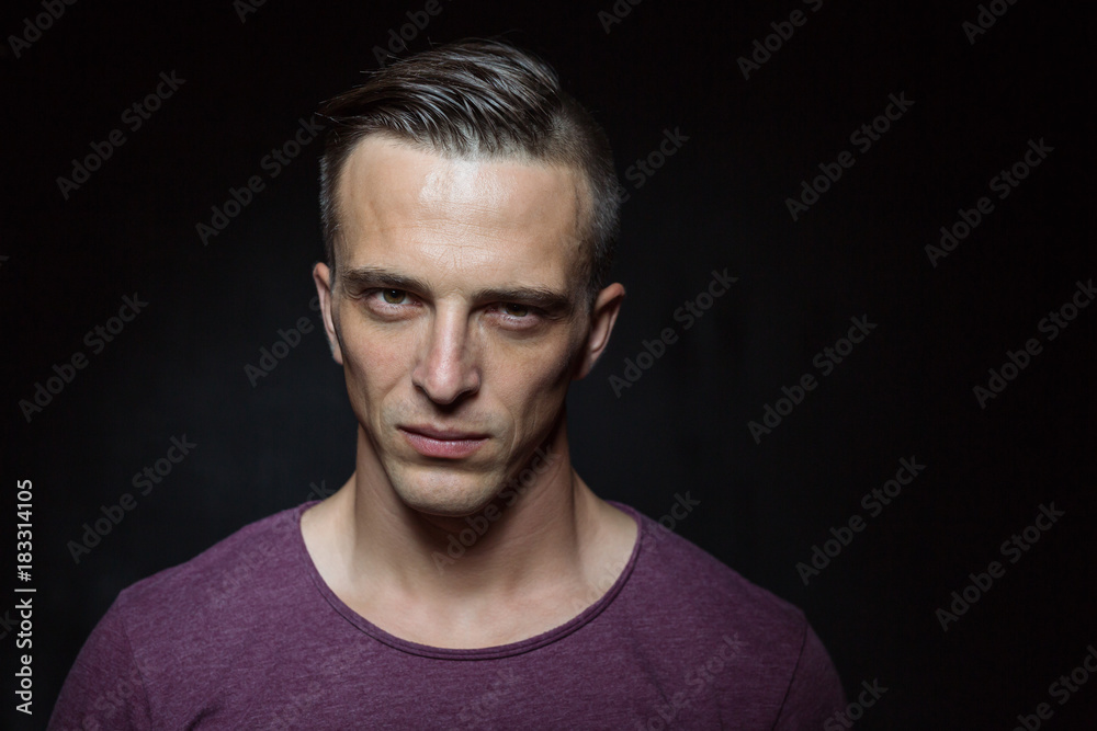 Portrait of bodybuilder shoor in studio on black background Portrait of bodybuilder shoor in studio on black background